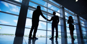 People shaking hands in an office